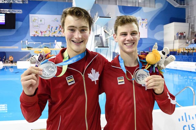 Philippe Gagné (left) and Vincent Riendeau after receiving their medals for the men's synchro 10m platform at TO2015.