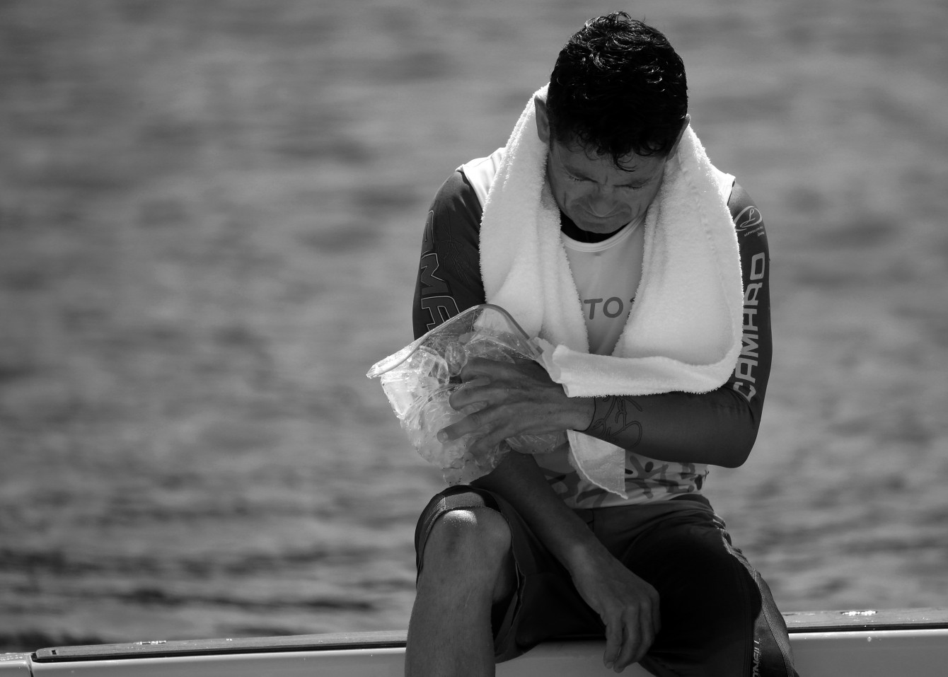 Jaret Llewellyn, 45, ices his elbow before finishing second in men's waterskiing and winning his 10th career Pan Am Games medal (COC photo by Greg Kolz).