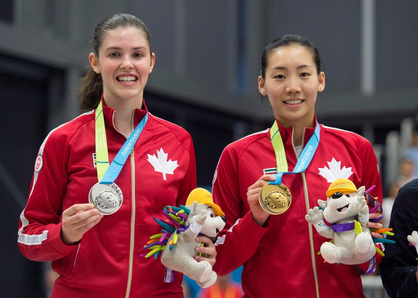 Rachel Honderich and Michelle Li Rachel Honderich (left) holds up her silver medal next to Michelle Li, who won women's singles at TO2015.