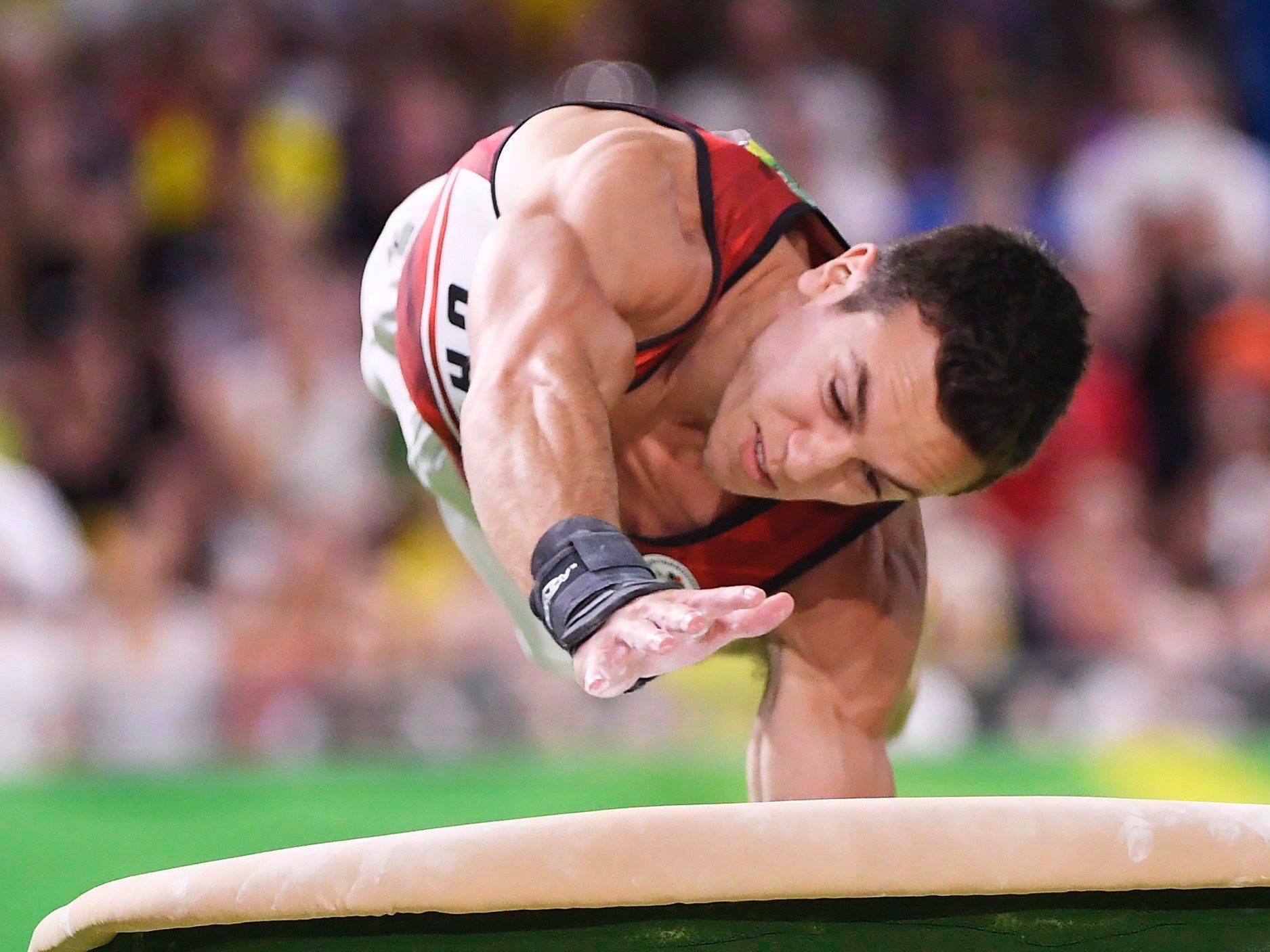 René Cournoyer on horizontal bars