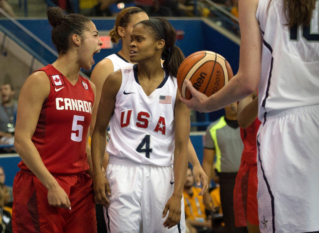 Moriah Jefferson of the United States looks on as Canada's Kia Nurse celebrates a basket and foul during gold medal action at the Pan American games in Toronto, July 20, 2015 (COC Photo by Jason Ransom). 