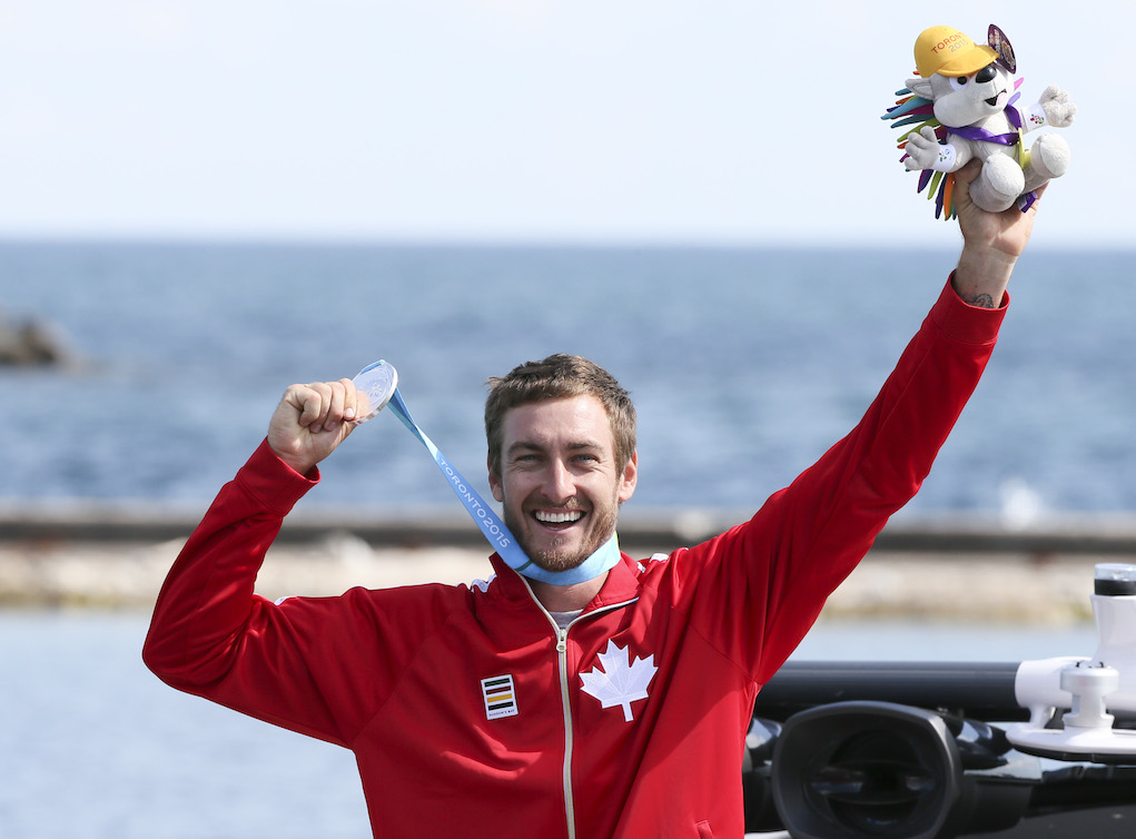 Jason McClintock posing with his medal