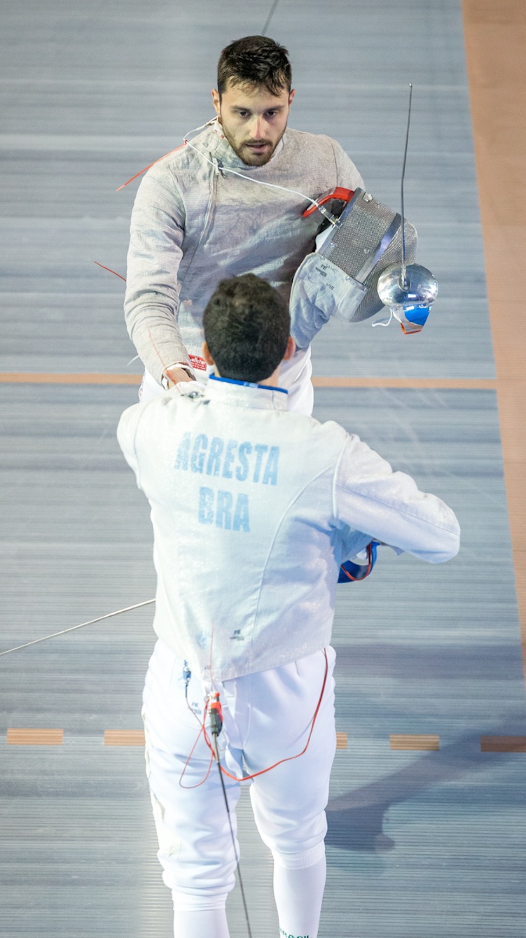 Joseph Polossifakis shakes his competitor's hand