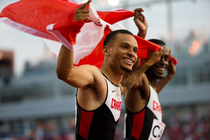 4x100m relay - TO2015 Team Canada celebrates its short-lived victory in mens's 4x100 relay before disqualification during the 2015 Pan Am Games in Toronto, July 25 2015 (John Fernandez for COC).