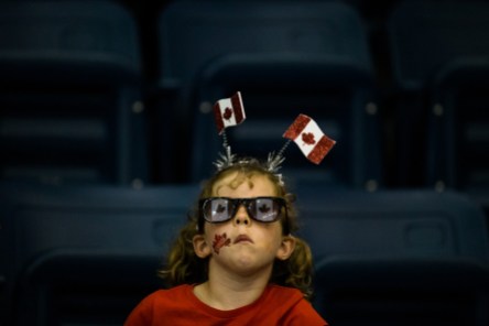 Team Canada fan - TO2015 A girl supporting Team Canada is seen in the stands at Ryerson Athletic Centre in Toronto, during the Canada v. Argentina basketball game, July 17 2015 (John Fernandez for COC).