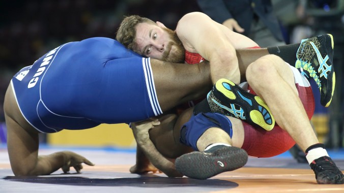 Korea Jarvis (red) of Elliot Lake, Ont. defeated Edgardo Lopez of Puerto Rico in the freestyle wrestling preliminaries at the PanAmerican Games in Mississauga, Ont., Saturday, July 18, 2015. Photo by Mike Ridewood
