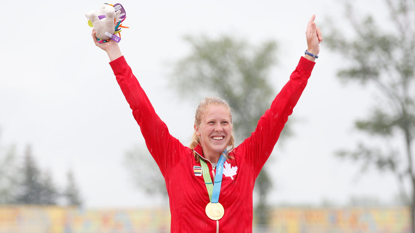 Laurence Vincent Lapointe celebrates the first-ever Pan Am Games women's canoe gold medal on July 14, 2015. 
