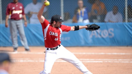 Canadian men's softball team competes in the gold medal match against Venezuela. Photo by Winston Chow