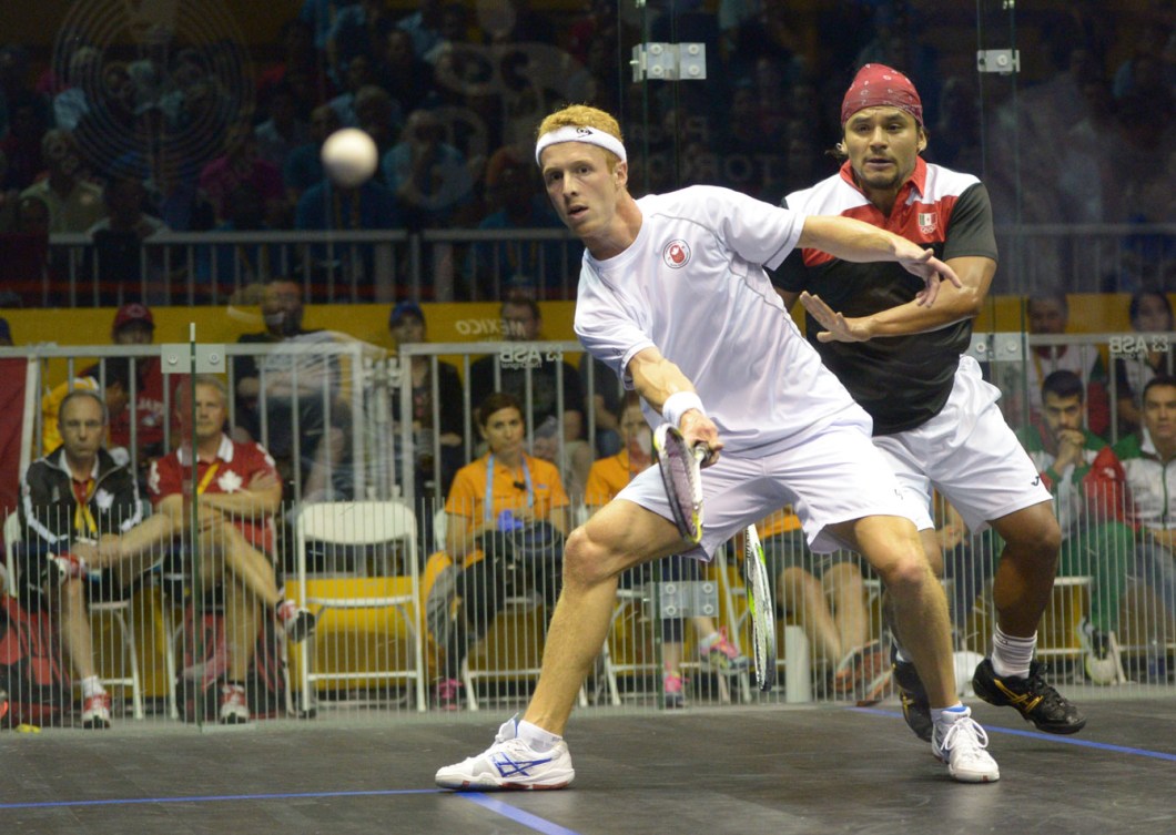 Andrew Schnell hits a shot against Mexican Eric Galvez. (Photo: Winston Chow)