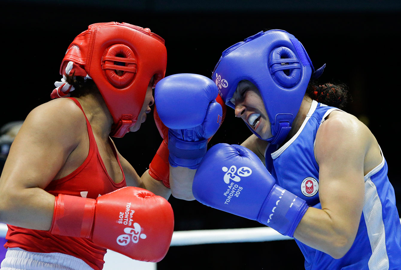 Canada’s Mandy Bujold, right, battles with Marlin Esparza of the U.S. in their women’s flyweight boxing final at the Pan Am Games in Oshawa, Ontario Saturday, July 25, 2015. Bujold defeated Esparza to claim the gold.