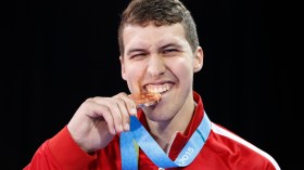 Marc-Andre Bergeron posing with his medal