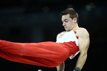 Rene Cournoyer competes in pommel horse