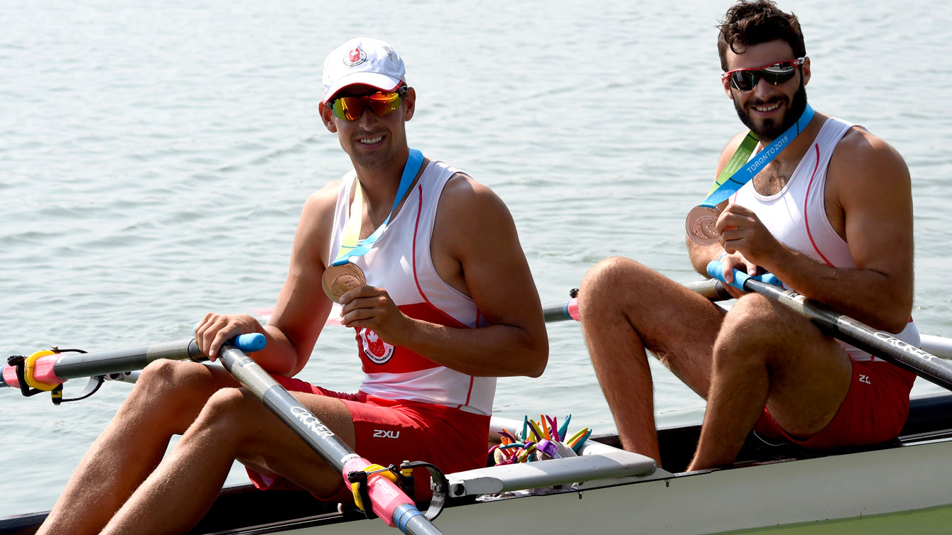Pascal Lussier and Matthew Buie take a photo with their Pan Am Games bronze on July 13, 2015. 