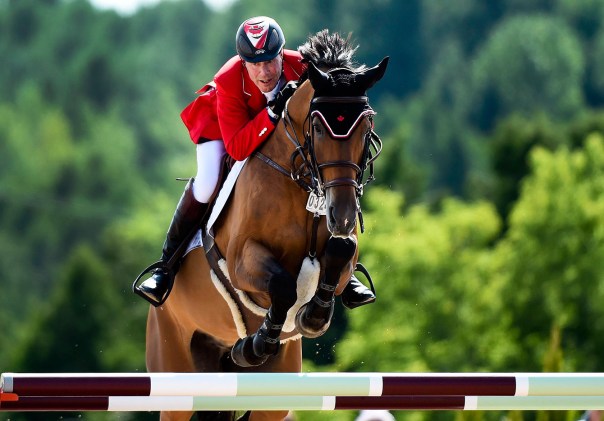 Ian Millar jumping in equestrian at Olympic Games