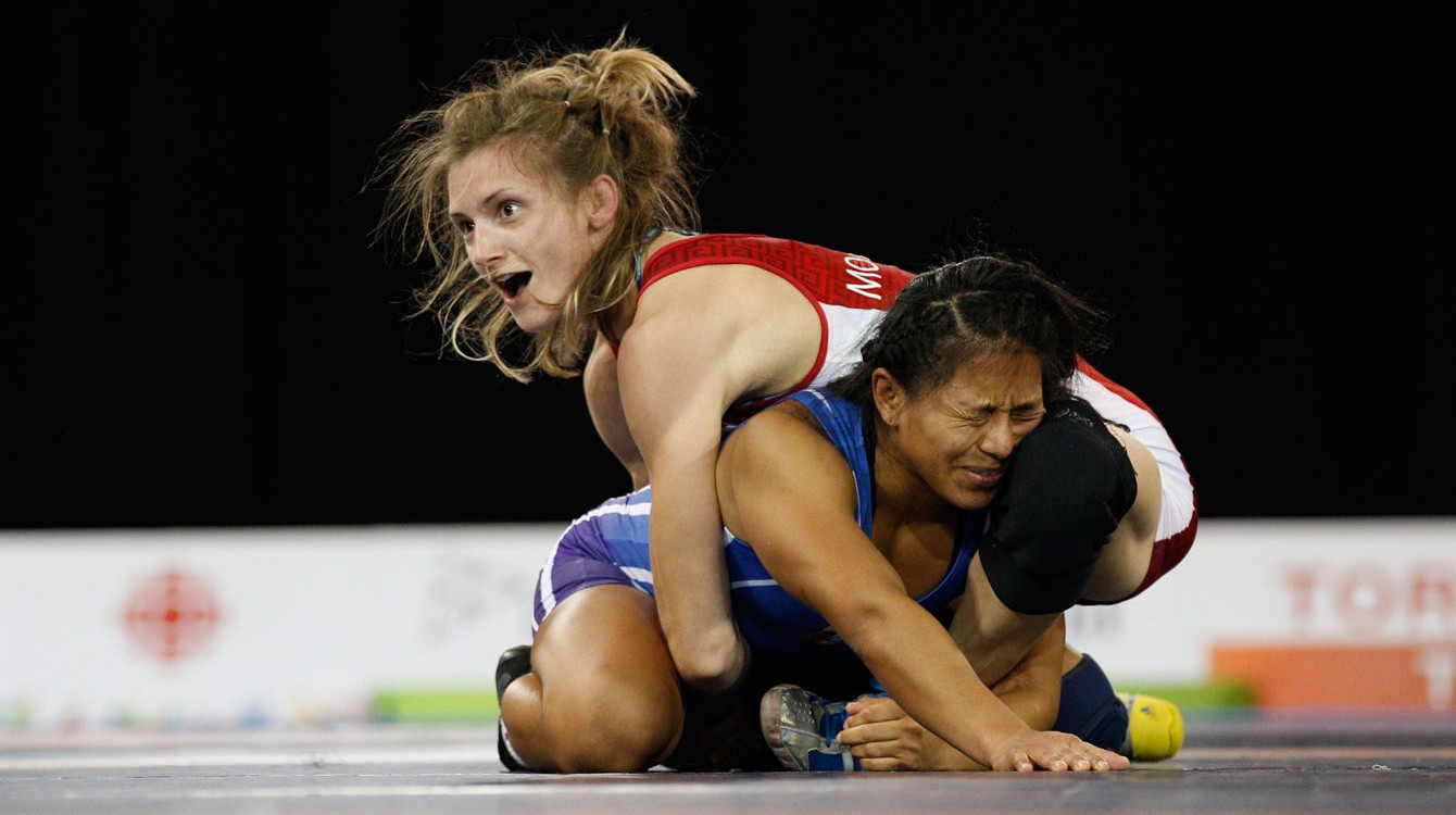 Genvieve Morrison (right) realizes time has run out and she has won Pan Am Games gold on July 16, 2015.