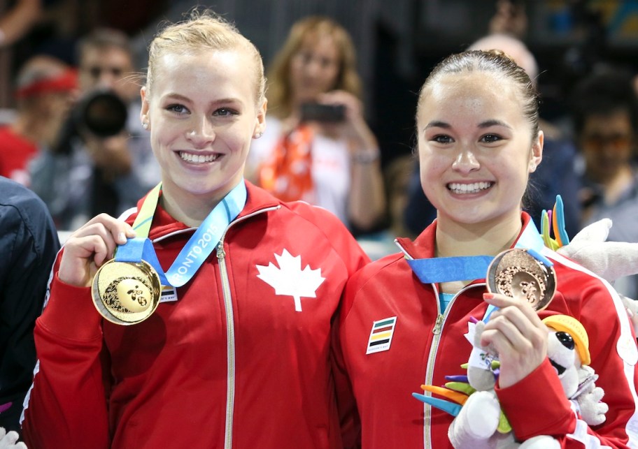 Ellie Black (left) of Halifax takes gold and Victoria Woo (right) of Brossard, Que. takes bronze in artistic gymnastics (beam)