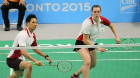 Alex Bruce (right) of Toronto and Toby Ng of Vancouver play in the mixed doubles badminton finals