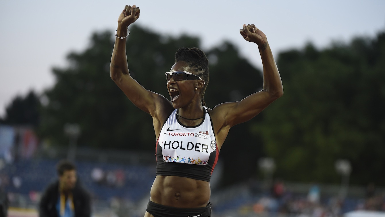 Nikkita Holder celebrates bronze in the women's 100m hurdles event at the Pan American Games in Toronto, July 21, 2015. 