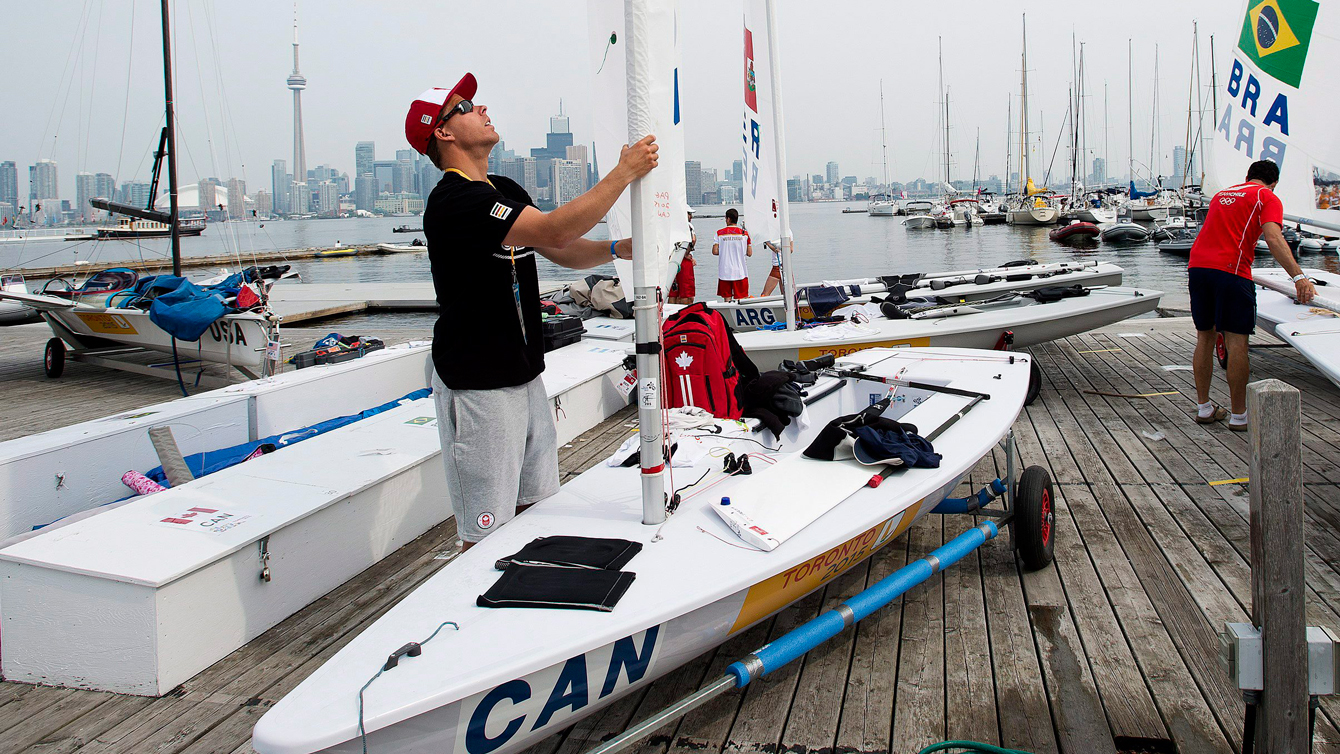Lee Parkhill works on his laser class boat at the Toronto 2015 Pan Am Games. 