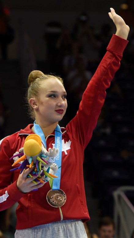 Patricia Bezzoubenko celebrates her bronze medal in the Individual All-Round competition in Rhythm Gymnastics at the Pan American Games in Toronto, July 18, 2015. Photo by Jason Ransom