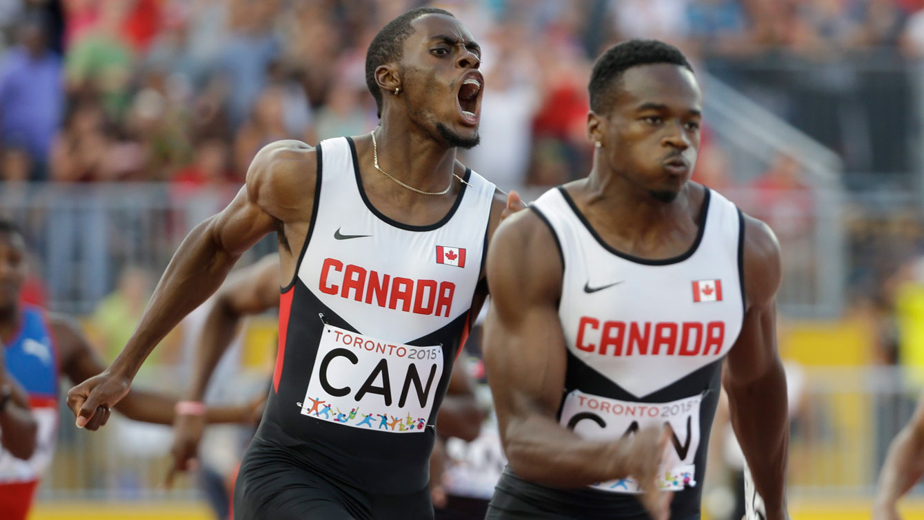 Brendon Rodney to Aaron Brown during the 4x100m Pan Am Games relay final on Saturday, July 25, 2015. 
