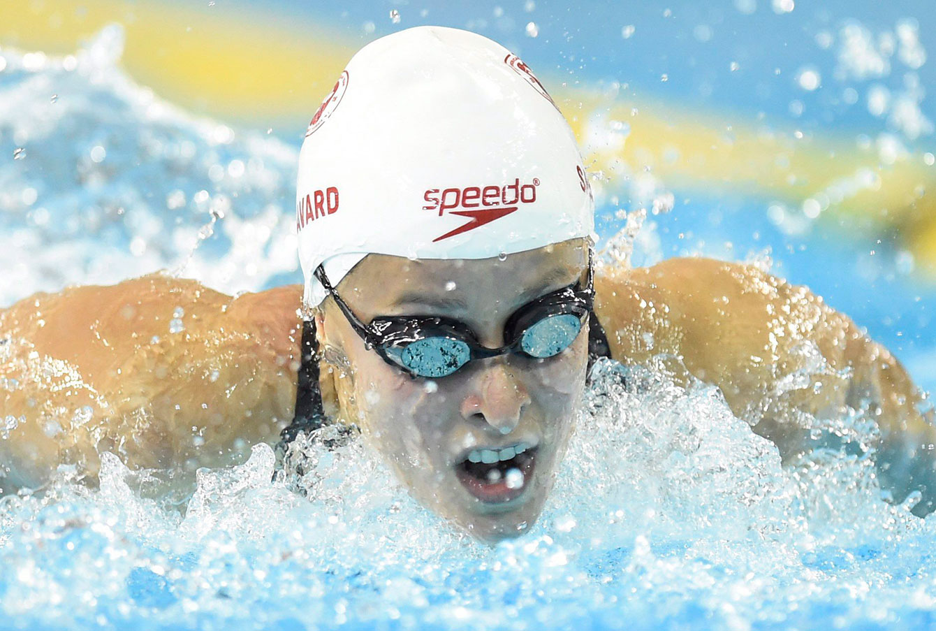 Katerine Savard races the women's 100m butterfly final. She ended up third behind silver-medal winning teammate Noemie Thomas.