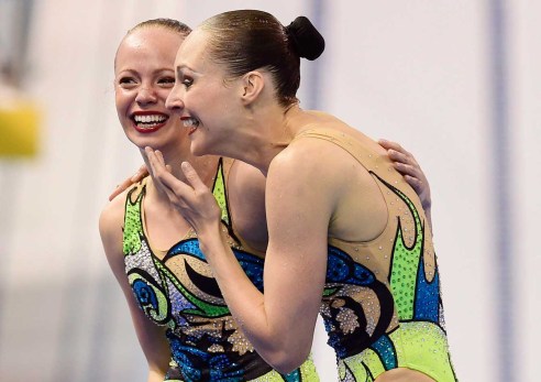 Jacqueline Simoneau (left) and Karine Thomas react after their free routine final at the Toronto 2015 Pan American Games, the pair won the gold medal and an Olympic spot. (Photo: CP)
