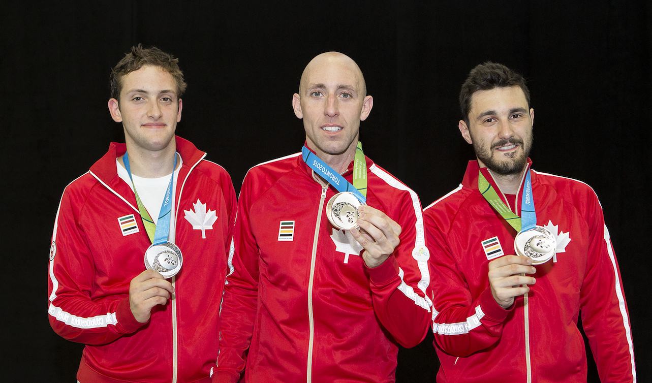 Shaul Gordon, Mark Peros and Joseph Polossifakis posing with their medals