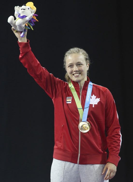 Dorothy Yeats (blue) of Montreal celebrates her gold medal in the freestyle wrestling finals at the PanAmerican Games in Mississauga, Ont., Friday, July 17, 2015. Photo by Mike Ridewood/COC