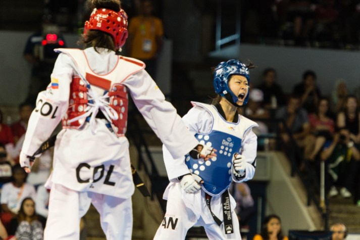 Yvette Yong - TO2015 Yvette Yong (blue) in women's taekwondo quarterfinals (COC Photo by Winston Chow)