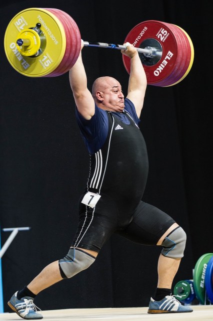 Canada's George Kobaladze attempts a clean and jerk lift in the men's 105+kg