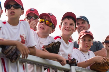 Men's Softball - TO2015 Men's Softball Young Canada fans watch with anticipation during the men's softball gold medal final between Canada and Venezuela at the 2015 Pan American Games in Toronto, Canada (COC Photo by Winston Chow).