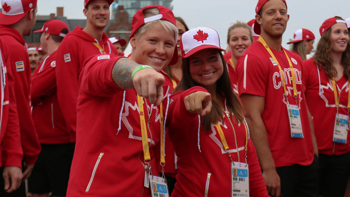 Women's rugby stars Jennifer Kish and Ashley Steacy - who have already qualified for Rio 2016 - at the athletes' village opening for Toronto 2015 Pan American Games (Photo: Alexandra Fernando).