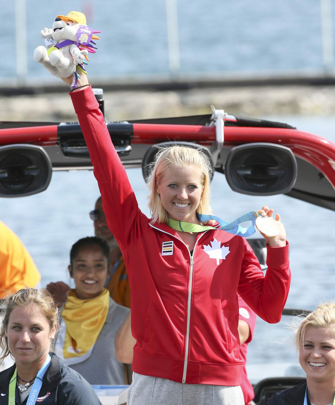 Whitney McClintock posing with her medal