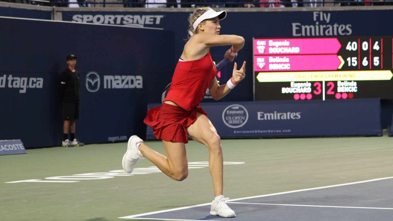 Eugenie Bouchard fires a return during the second set against Belinda Bencic at Rogers Cup in Toronto on August 11, 2015. 