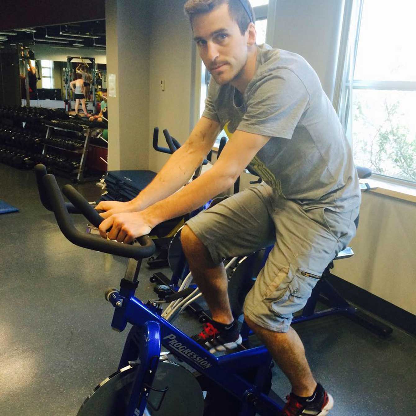 Denny Morrison on the stationary bike 12 days after his crash. 