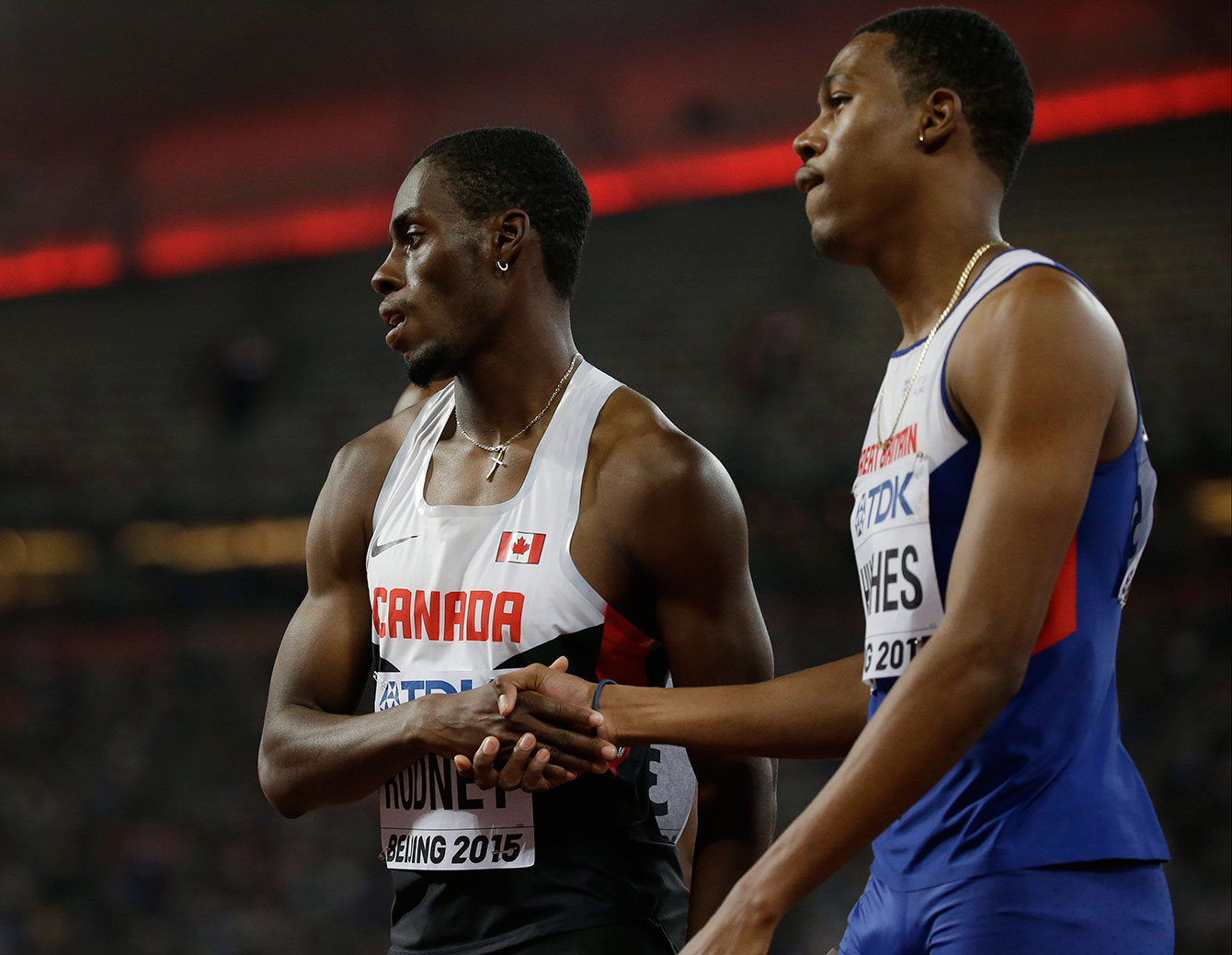 Brendon Rodney (left) with Zharnel Hughes of Great Britain after their 200m heat on August 25, 2015 at the IAAF World Championships in Athletics in Beijing, China. 