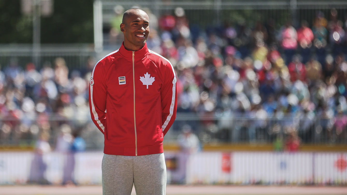Damian Warner on the podium prior to receiving his decathlon gold medal at Toronto 2015 Pan American Games (Photo: Alexandra Fernando).