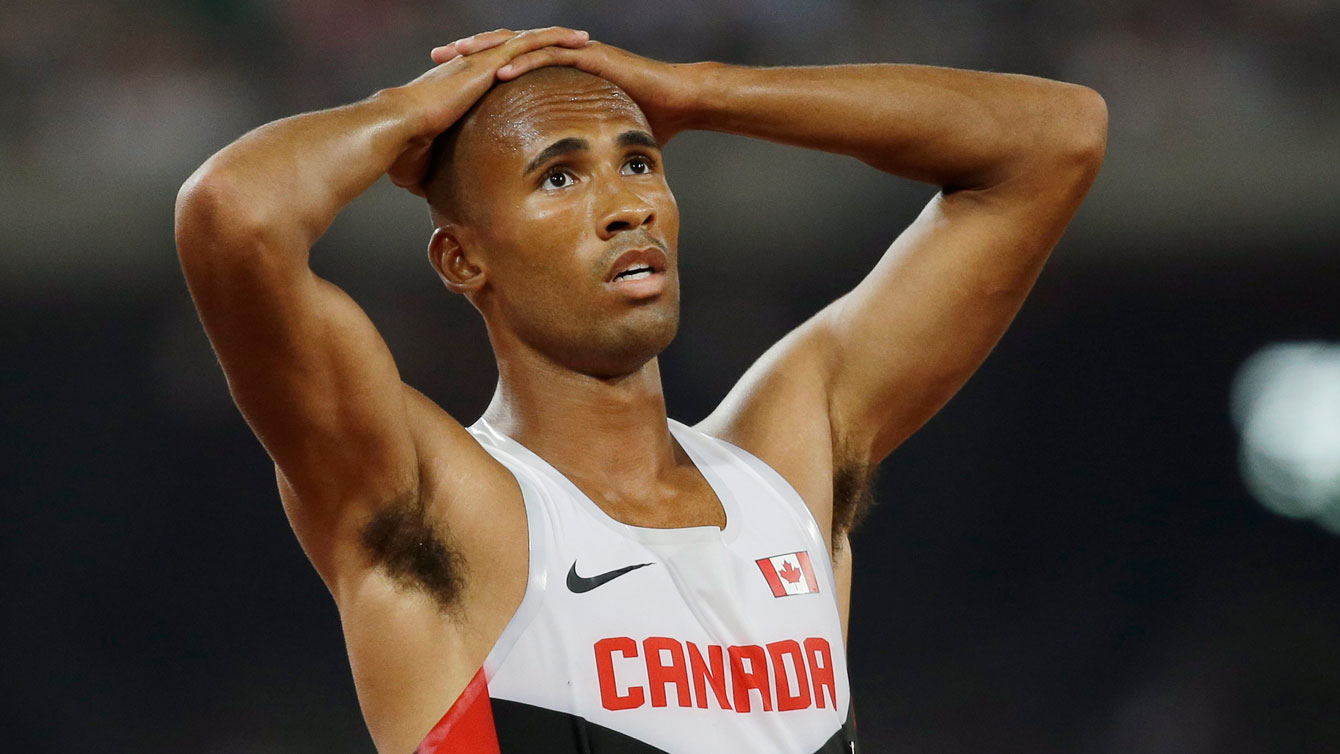 An exhausted Damian Warner looks on for official times and points at the end of the 1500m - the last event in the decathlon - of the world championships in athletics on August 29, 2015. 