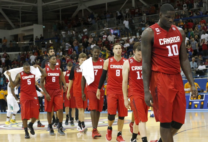 Anthony Bennett, right, leads the way as Canada leaves the court