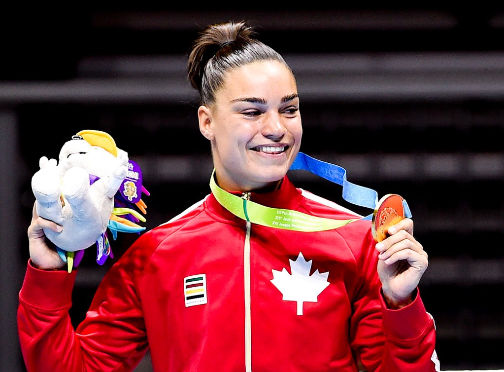 Caroline Veyre shows off her gold medal