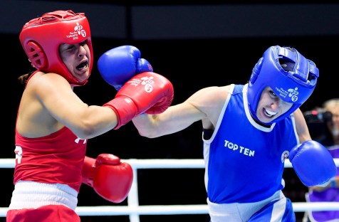 Mandy Bujold, right, of Canada, competes against Marlen Esparza, of the United States