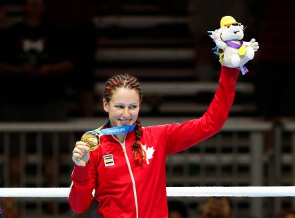 Canada's Mandy Bujold shows off her gold medal