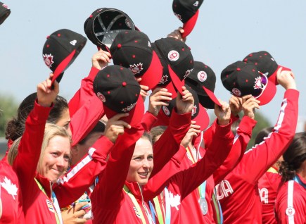 Canada's women's baseball team acknowledges fans after receiving their silver medals