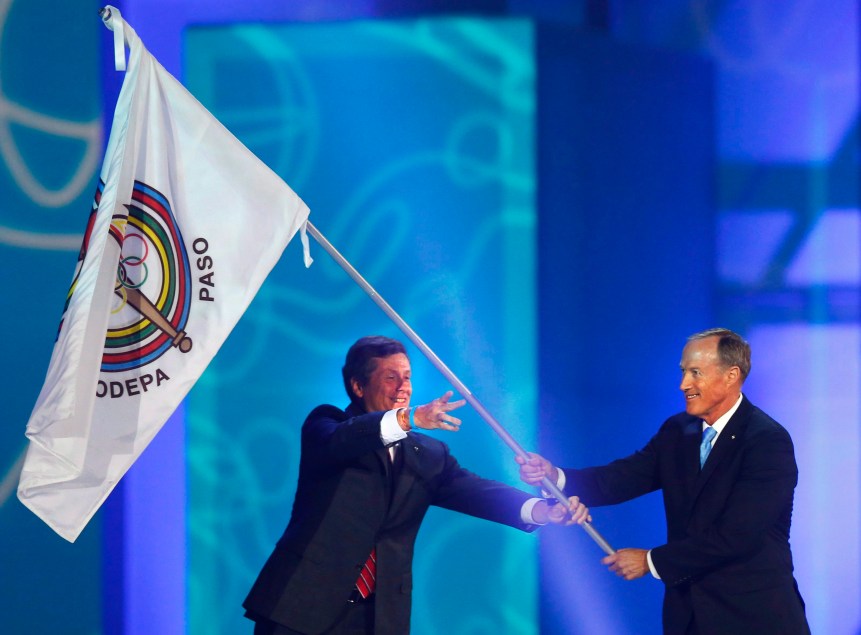 Closing Ceremony Pan Am 20150726 Toronto Mayor John Tory, left, passes the Pan American Sports Organization flag