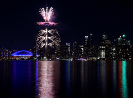 Fireworks light up the downtown Toronto city skyline during the closing ceremony for the Pan American Games
