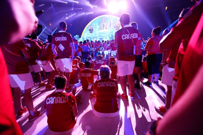 The Canadian delegation watches a performance during the closing ceremony of the Pan Am Games
