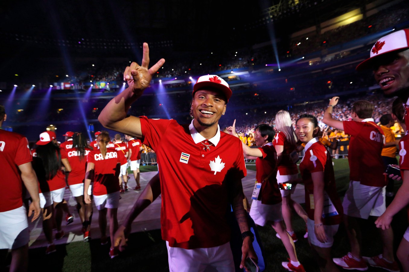 PAN AM OPENING CEREMONY 20150726 Andre De Grasse gives the peace sign