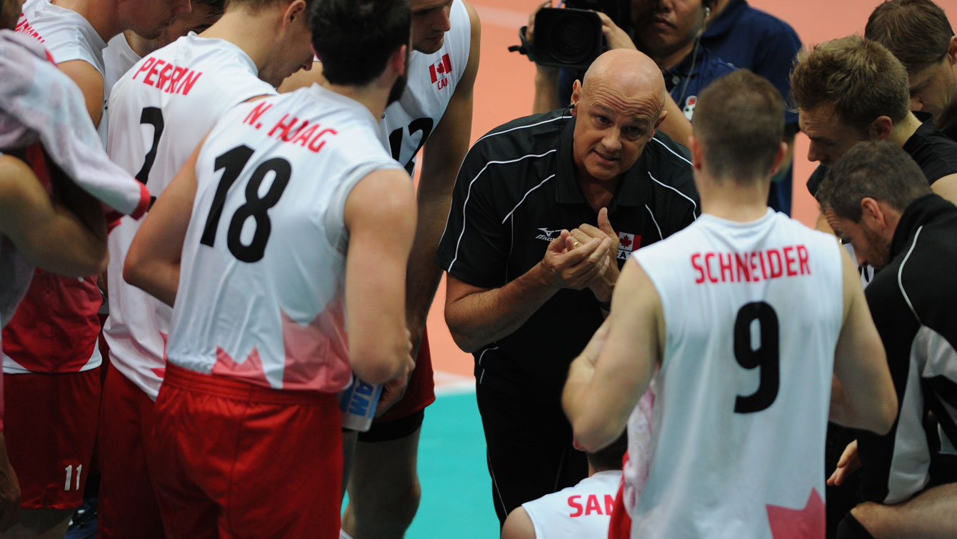 Canada head coach Glenn Hoag speaks to the team during a timeout 