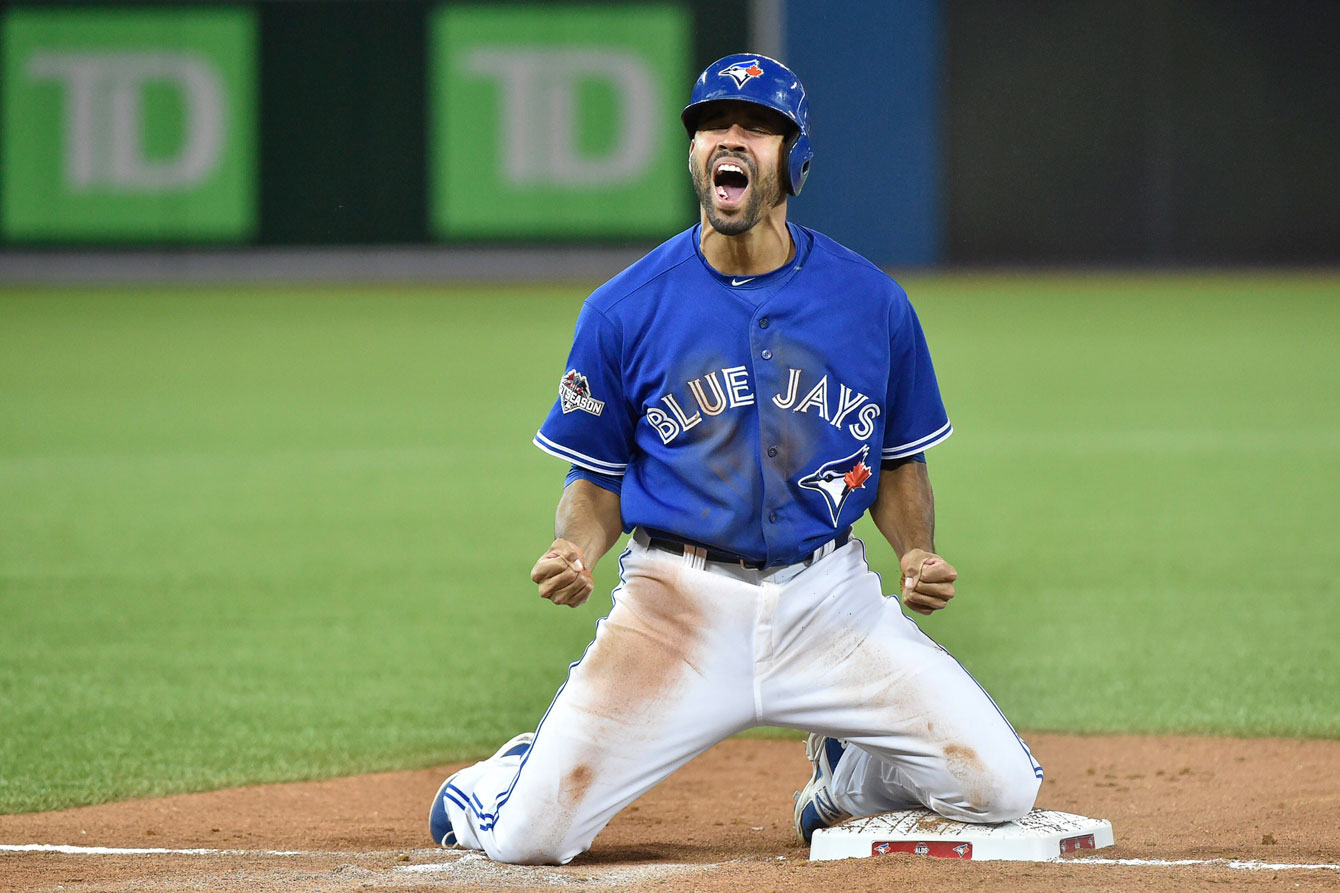 Dalton Pompey reacts to sliding in safe at third during Game 5 of the ALDS.